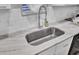 Modern kitchen sink with marble countertop and a retractable faucet at 320 Harry Ln, Moncks Corner, SC 29461