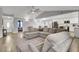 Open-concept living room with sectional sofa and kitchen views at 320 Harry Ln, Moncks Corner, SC 29461