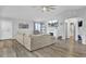 Open living space with hardwood floors, sectional sofa, and fireplace at 320 Harry Ln, Moncks Corner, SC 29461