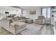 Spacious living room with L-shaped sectional sofa and hardwood floors at 320 Harry Ln, Moncks Corner, SC 29461