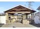 Covered patio features an outdoor kitchen, fireplace, and TV at 320 Harry Ln, Moncks Corner, SC 29461
