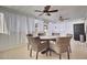 Relaxing screened porch with wicker dining set and ceiling fans at 320 Harry Ln, Moncks Corner, SC 29461