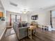 Living room with sectional sofa, hardwood floors, and ceiling fan at 341 Iveson Rd, Summerville, SC 29486