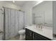 Bathroom featuring a dark vanity, white toilet, and patterned shower curtain at 3687 Spindrift Dr, Mount Pleasant, SC 29466