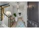 Bright entryway with hardwood floors, staircase, and view to living room at 3809 Tupelo Branch Row, Mount Pleasant, SC 29429