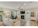 Spacious living room with hardwood floors, fireplace, and comfortable seating at 3809 Tupelo Branch Row, Mount Pleasant, SC 29429