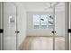 Light filled bedroom with hardwood floors and double doors at 3908 Delinger Dr, Mount Pleasant, SC 29466