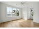 Bright bedroom with hardwood floors, ceiling fan, and large windows at 3908 Delinger Dr, Mount Pleasant, SC 29466