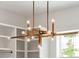 Modern gold chandelier with clear glass globes in a walk-in closet at 3908 Delinger Dr, Mount Pleasant, SC 29466