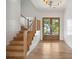 Light and bright entryway with hardwood floors and staircase at 3908 Delinger Dr, Mount Pleasant, SC 29466