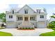 White two-story home with metal roof, and a large front porch at 3908 Delinger Dr, Mount Pleasant, SC 29466