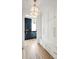 Bright hallway with built-in storage and a view into a dark kitchen at 3908 Delinger Dr, Mount Pleasant, SC 29466