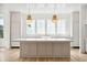 Modern kitchen with large island, white cabinets, and high-end appliances at 3908 Delinger Dr, Mount Pleasant, SC 29466