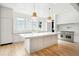 Modern kitchen with large island, white cabinets, and high-end appliances at 3908 Delinger Dr, Mount Pleasant, SC 29466