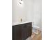Stylish powder room with dark vanity, white countertop, and toilet at 3908 Delinger Dr, Mount Pleasant, SC 29466