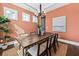 Spacious dining room, coral walls, and a wooden table with seating for six at 3913 Maidstone Dr, Mount Pleasant, SC 29466