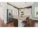 Modern kitchen, white cabinets, granite island, and stainless steel appliances at 3913 Maidstone Dr, Mount Pleasant, SC 29466