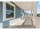 Covered porch with white railings and wood flooring at 3913 Maidstone Dr, Mount Pleasant, SC 29466