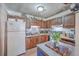 Kitchen with wood cabinets and island at 4 Ferncliff Way, Goose Creek, SC 29445