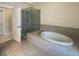 Elegant bathroom with soaking tub and walk-in shower at 4140 Home Town Ln, Ravenel, SC 29470
