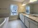 Double vanity bathroom with granite countertops and tile floors at 4140 Home Town Ln, Ravenel, SC 29470
