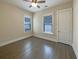 Bright bedroom featuring hardwood floors and ceiling fan at 4140 Home Town Ln, Ravenel, SC 29470
