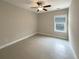 Well-lit bedroom with tile floors and ceiling fan at 4140 Home Town Ln, Ravenel, SC 29470