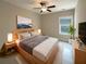 Main bedroom with large bed, TV and natural light at 4140 Home Town Ln, Ravenel, SC 29470