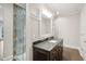 Bathroom with dark vanity and granite countertop at 4169 Longmarsh Rd, Mount Pleasant, SC 29429