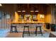 Rustic kitchen with brick bar, pendant lighting, and wooden cabinetry at 4169 Longmarsh Rd, Mount Pleasant, SC 29429