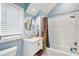 Charming bathroom with white subway tile, updated vanity, and tub shower at 42 Sowell St, Mount Pleasant, SC 29464