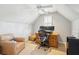 Cozy attic office space with hardwood floors and built-in shelving at 42 Sowell St, Mount Pleasant, SC 29464