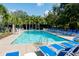 Inviting community pool with numerous lounge chairs at 42 Sowell St, Mount Pleasant, SC 29464