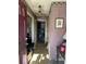 Home entryway with patterned wallpaper and cluttered floor at 4328 Helene Dr, North Charleston, SC 29418