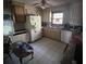 Kitchen with white cabinets, appliances, and cluttered counters at 4328 Helene Dr, North Charleston, SC 29418