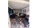 Messy living room with maroon couches and cluttered floor at 4328 Helene Dr, North Charleston, SC 29418