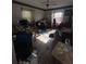 An office with a table, and lots of items and papers at 4328 Helene Dr, North Charleston, SC 29418