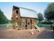 Wooden barn-themed playground with slide at 444 Parish Farms Dr, Summerville, SC 29486