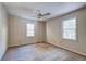 Empty bedroom with carpeted floors and two windows at 4960 Lambs Rd, North Charleston, SC 29418