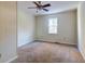 Spacious bedroom with carpeted floor and large window at 4960 Lambs Rd, North Charleston, SC 29418