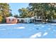 Brick house with sunroom and snowy yard at 4960 Lambs Rd, North Charleston, SC 29418