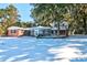 Back of house with sunroom and deck, covered in snow at 4960 Lambs Rd, North Charleston, SC 29418