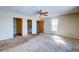 Main bedroom with carpet, ceiling fan, and en-suite bathroom at 4960 Lambs Rd, North Charleston, SC 29418