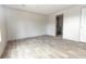 Spacious bedroom with wood-look flooring and ensuite bathroom at 520 Branch Bend Way, Cross, SC 29436