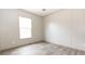 Simple bedroom with wood-look flooring and a window at 520 Branch Bend Way, Cross, SC 29436