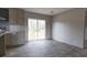 Dining area with sliding glass doors leading to a deck and light wood flooring at 520 Branch Bend Way, Cross, SC 29436