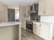 Modern kitchen features stainless steel appliances and light-toned cabinetry at 520 Branch Bend Way, Cross, SC 29436