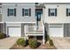 Townhouse exterior with attached garage and stairs to entrance at 556 Mclernon Trce, Johns Island, SC 29455