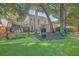 Backyard with putting green, patio and trees at 602 Leaning Pin Ct, Summerville, SC 29485