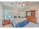 Comfortable bedroom with a king-size bed and large windows at 602 Leaning Pin Ct, Summerville, SC 29485